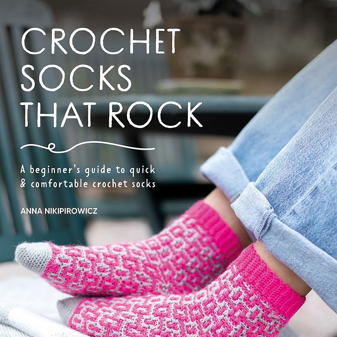 Book cover of 'Crochet Socks That Rock' by Anna Nikpirowicz with pink crochet socks on a blurred background.