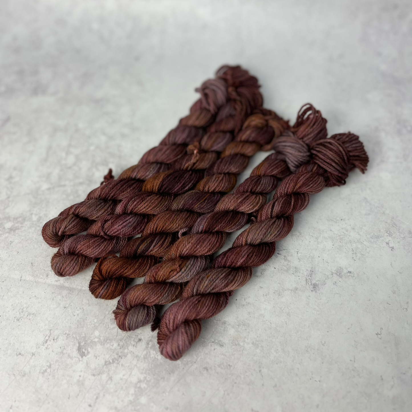 Chocolate Brown Merino Nylon Mini skein shown against a neutral background.