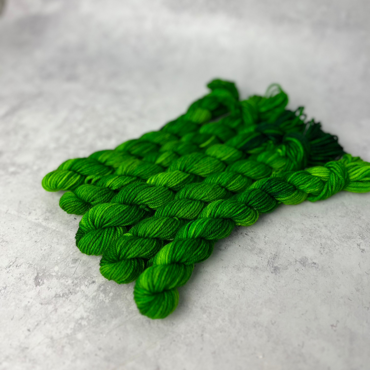 Emerald Merino Nylon Mini skein shown against a neutral background.