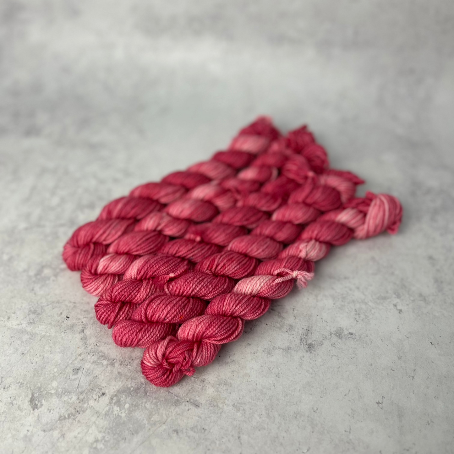Rose Pink Merino Nylon Mini skein shown against a neutral background.
