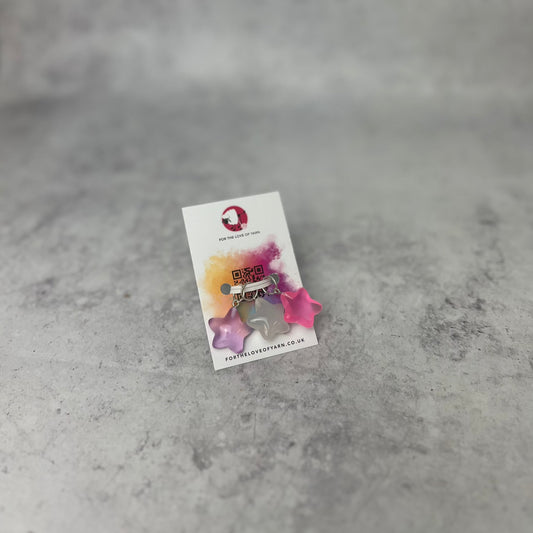 A set of "star" progress keepers with ring style attachment, on a backing card.