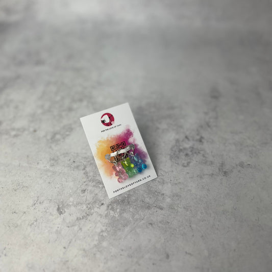 Set of "gummy bear" progress keepers with ring style attachment, shown on a backing card.