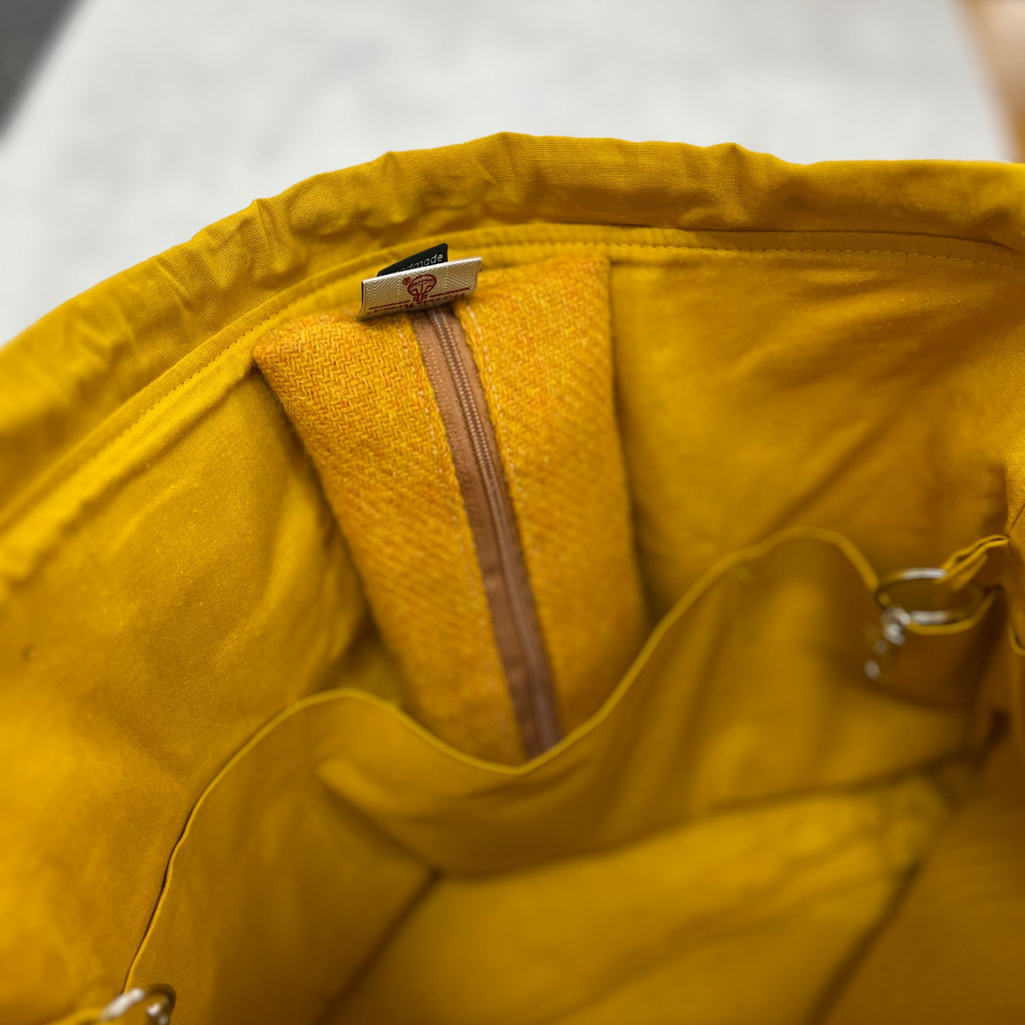 Zipped case displayed inside one of the six internal pockets.
