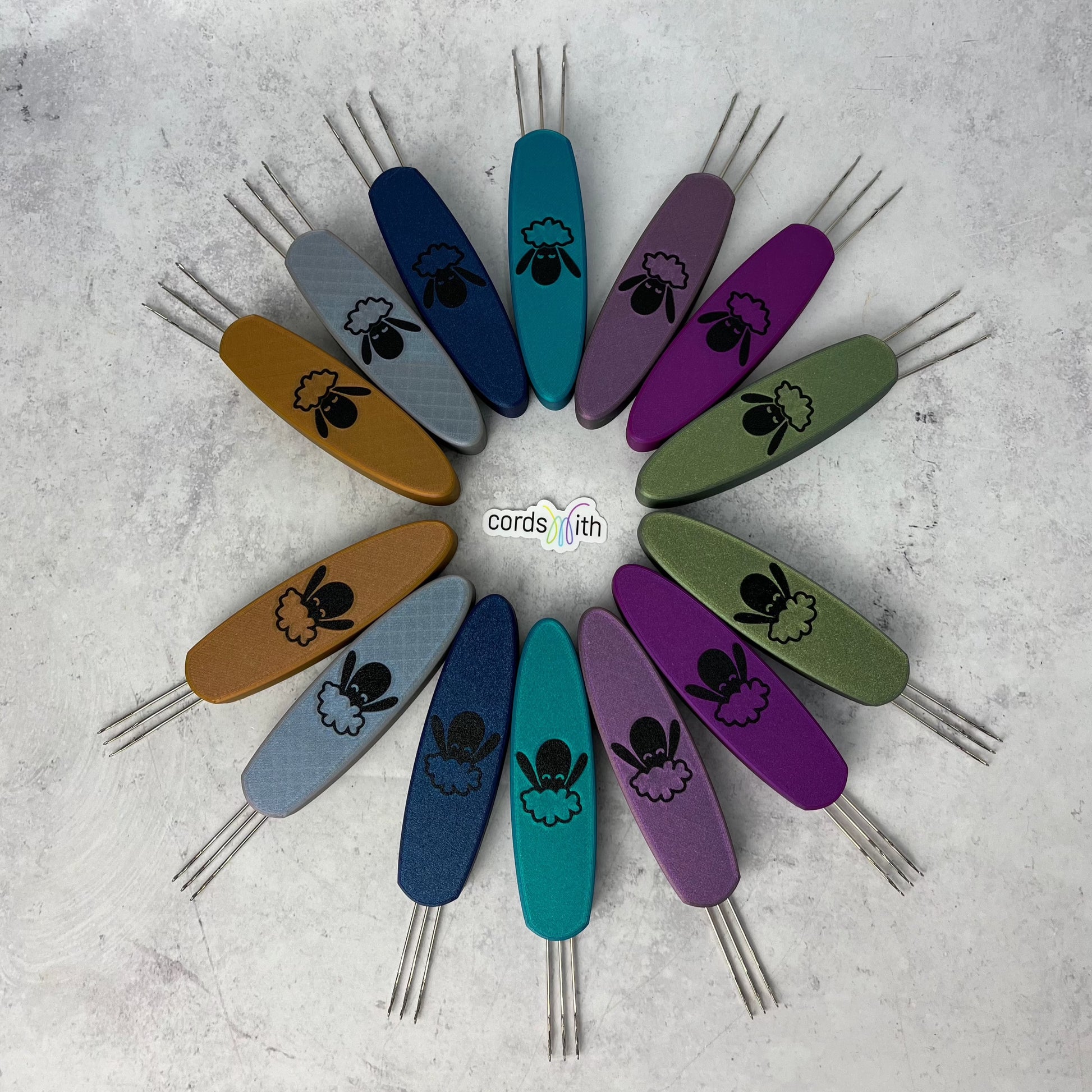 A wheel arrangement of Cordsmith Tools, with the top half of the wheel being the Original Size Cordsmith, and the bottom half the Mini size