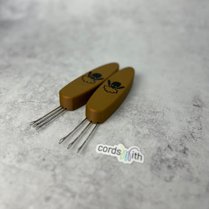 Gold Cordsmith tools, Mini on the left, Original on the right.