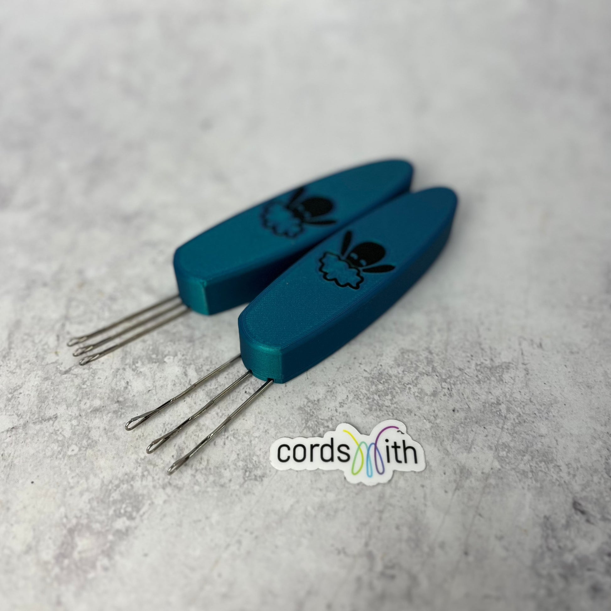 Cordsmith Tool in Teal Blue, with mini on the left, original on the right.