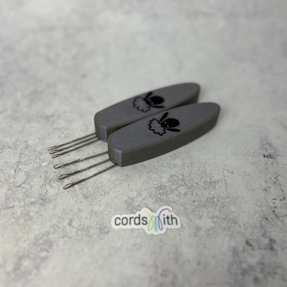 Cordsmith Tool in Silver, with Mini size on the left and original on the right.