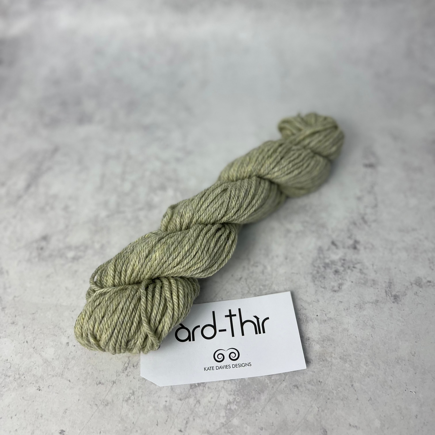 Skein of Kiloran with label showing, set against a neutral background.