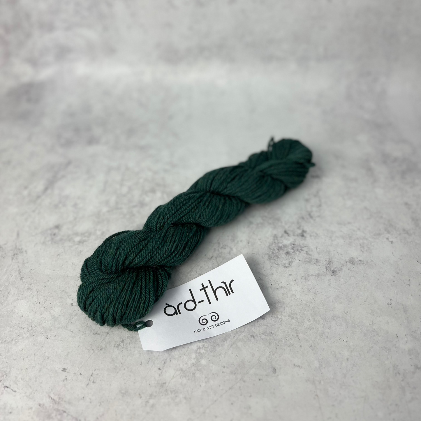 Skein of Luskentyre with label showing, set against a neutral background.