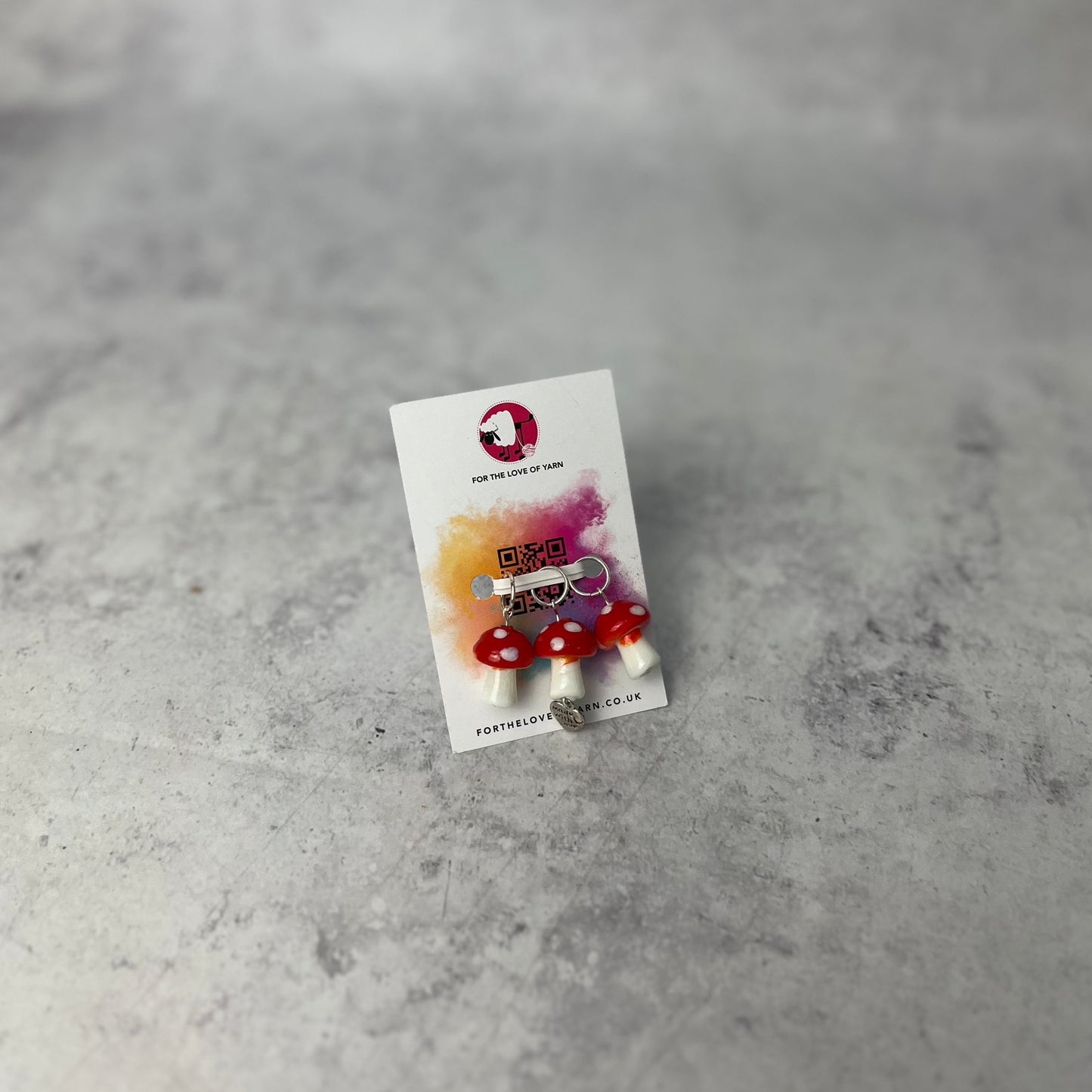 Set of "mushroom" progress keepers with ring style attachment, shown on a a backing card.