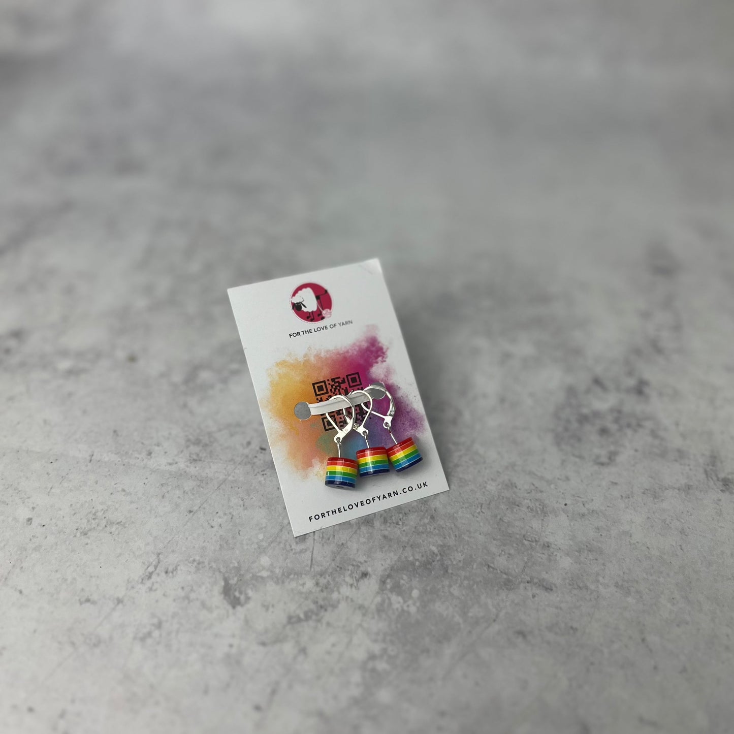 Set of "rainbow" progress keepers with clasp style attachment, shown on a backing card.