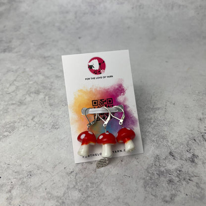 Set of "mushrooms" progress keepers with clasp style attachment, shown on a backing card.